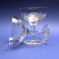 Pair of engraved crystal Champagne glasses.